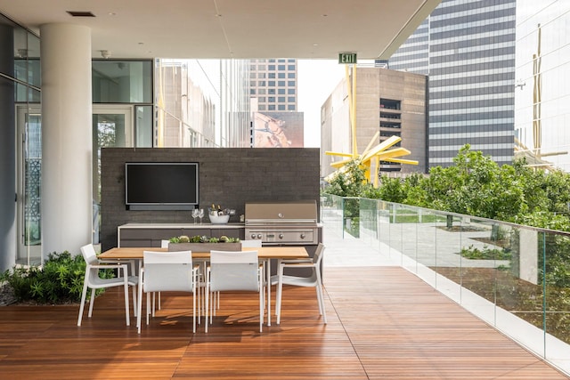exterior space featuring a grill, outdoor dining area, and visible vents