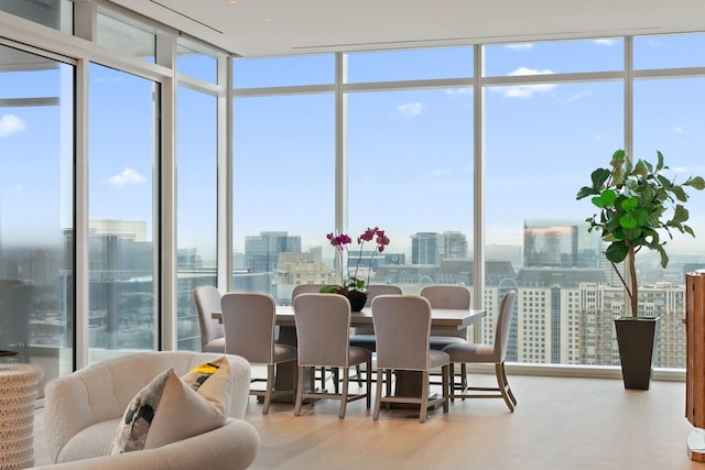 sunroom / solarium with a view of city and a healthy amount of sunlight