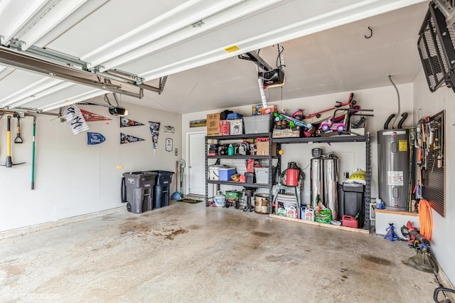garage with a garage door opener and electric water heater