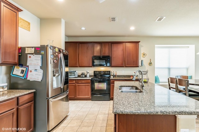 kitchen featuring recessed lighting, visible vents, a sink, and black appliances