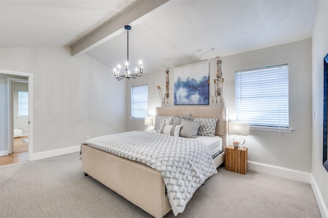bedroom with lofted ceiling with beams, multiple windows, an inviting chandelier, and light carpet