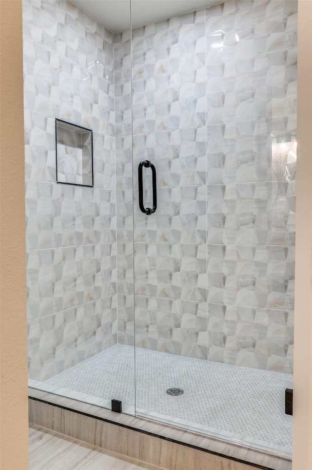 bathroom featuring a stall shower