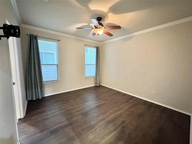 spare room with baseboards, dark wood finished floors, and ceiling fan