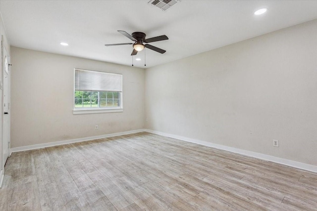 empty room with visible vents, light wood-style floors, baseboards, recessed lighting, and a ceiling fan