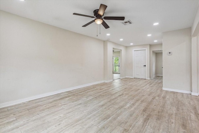 unfurnished room featuring ceiling fan, visible vents, light wood-type flooring, baseboards, and recessed lighting