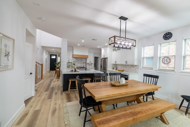 12472 Jack Pine Ct, Frisco, TX 75035 - dining room featuring light wood finished floors, baseboards, a chandelier, and recessed lighting