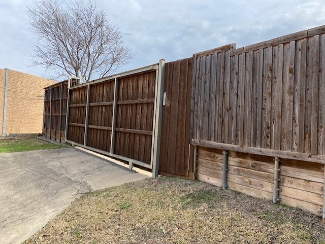 view of gate featuring fence