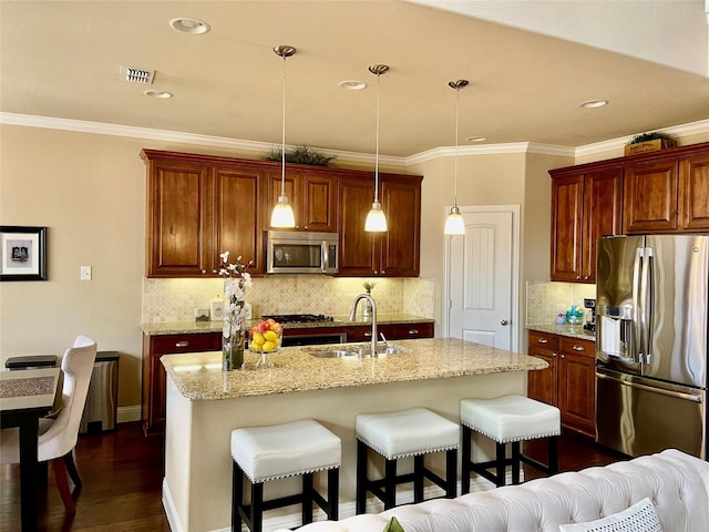 3724 Estates Way, Mckinney, TX 75072 - kitchen with appliances with stainless steel finishes, a breakfast bar, a sink, visible vents, and dark wood-style floors