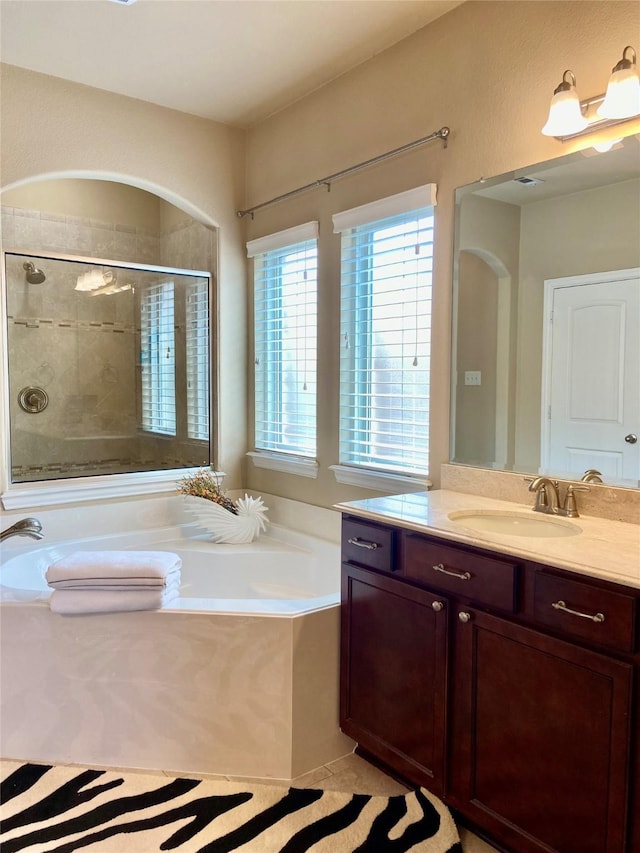 3724 Estates Way, Mckinney, TX 75072 - full bathroom featuring vanity, a bath, and a stall shower