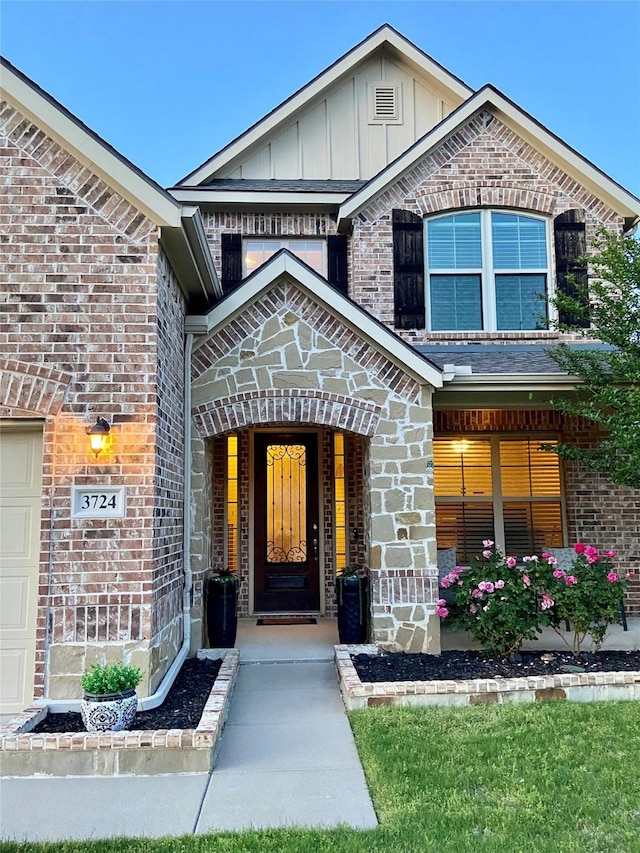 3724 Estates Way, Mckinney, TX 75072 - property entrance featuring brick siding and board and batten siding