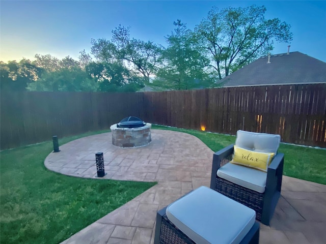 3724 Estates Way, Mckinney, TX 75072 - patio terrace at dusk with a lawn, a fenced backyard, and an outdoor fire pit