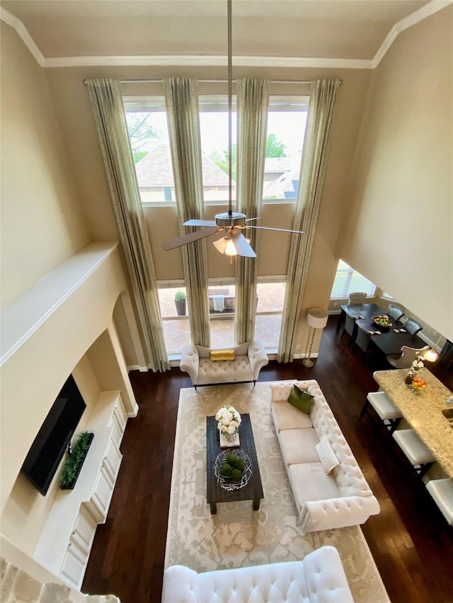3724 Estates Way, Mckinney, TX 75072 - living room featuring crown molding, a ceiling fan, wood finished floors, and a wealth of natural light