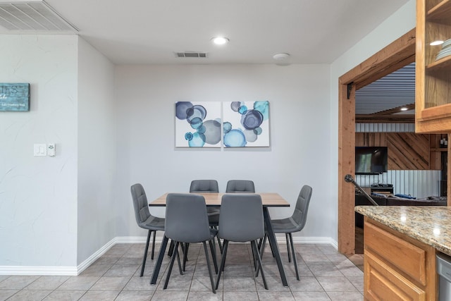 231 Granada Calle St, Granbury, TX 76049 - dining area with baseboards, light tile patterned floors, and recessed lighting