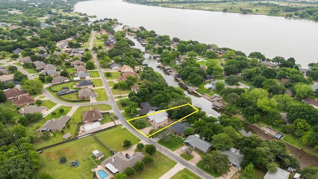 231 Granada Calle St, Granbury, TX 76049 - aerial perspective of suburban area with a nearby body of water and property boundaries highlighted