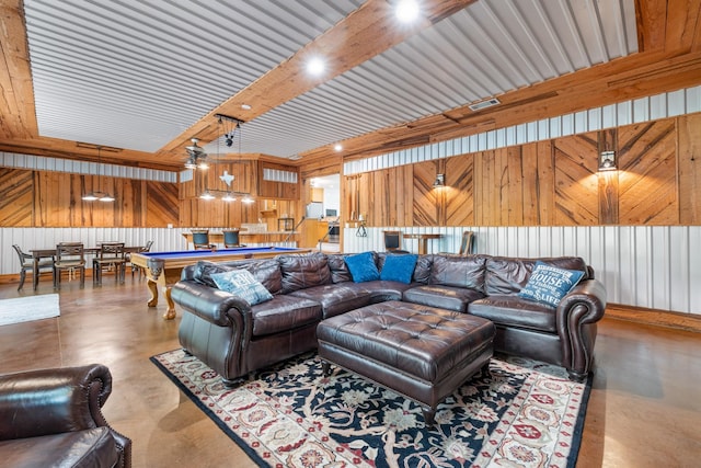 231 Granada Calle St, Granbury, TX 76049 - living area featuring concrete flooring, pool table, and wood walls