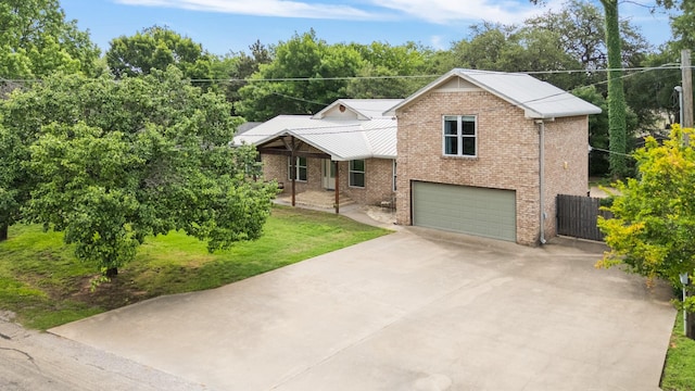231 Granada Calle St, Granbury, TX 76049 - view of front of property featuring brick siding, an attached garage, driveway, and metal roof