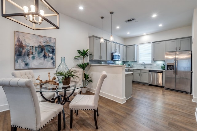 dining room featuring visible vents, recessed lighting, a chandelier, and dark wood-style floors