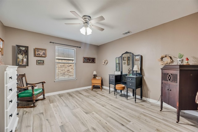 office area with ceiling fan, visible vents, baseboards, and light wood-type flooring