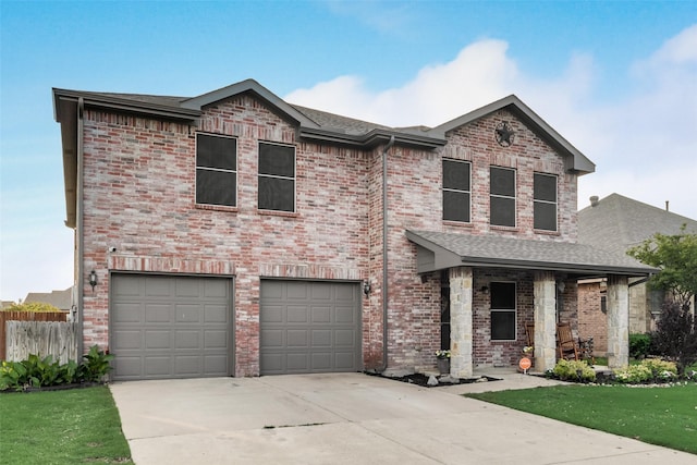 view of front of house featuring roof with shingles, fence, an attached garage, a front yard, and concrete driveway