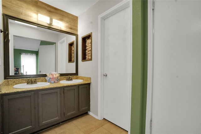 bathroom featuring a sink, tile patterned floors, and double vanity