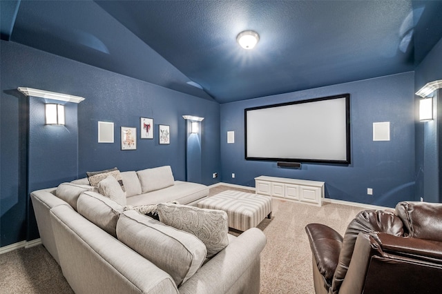 home theater with baseboards, carpet flooring, and vaulted ceiling