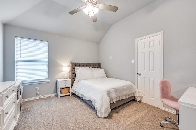 bedroom with baseboards, a ceiling fan, vaulted ceiling, and light carpet