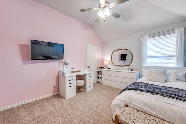 bedroom featuring a ceiling fan, light carpet, and vaulted ceiling