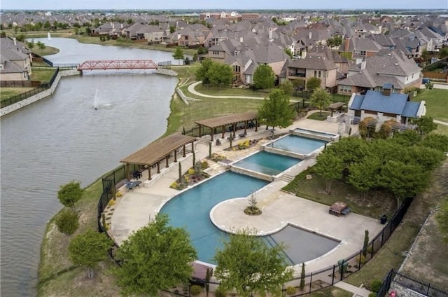 bird's eye view featuring a water view and a residential view