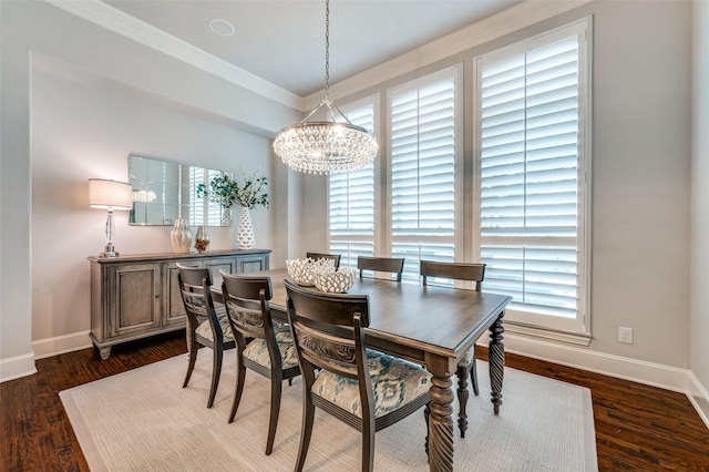 dining room with a healthy amount of sunlight, baseboards, and a notable chandelier