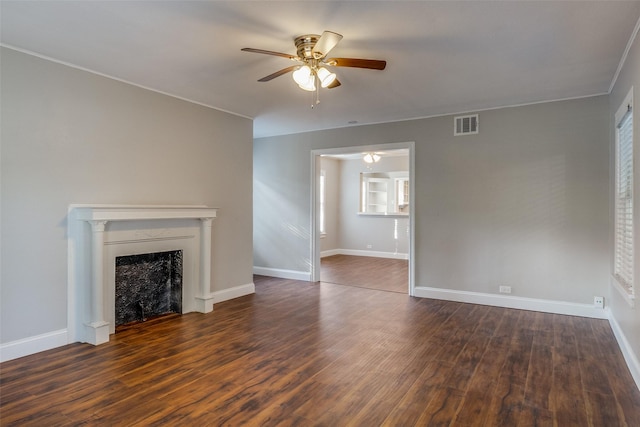 unfurnished living room with visible vents, baseboards, ceiling fan, and wood finished floors