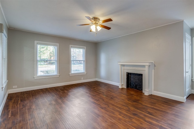 unfurnished living room featuring a ceiling fan, dark wood-style flooring, and a fireplace
