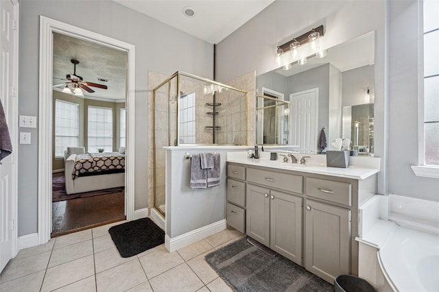 ensuite bathroom featuring ceiling fan, vanity, ensuite bath, tile patterned floors, and a stall shower