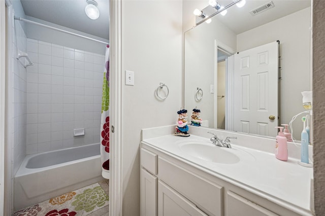 bathroom featuring visible vents, tile patterned floors, shower / tub combo, and vanity