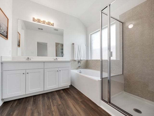 2913 Meadowlands Dr, Forney, TX 75126 - bathroom featuring double vanity, a bath, a sink, a stall shower, and vaulted ceiling