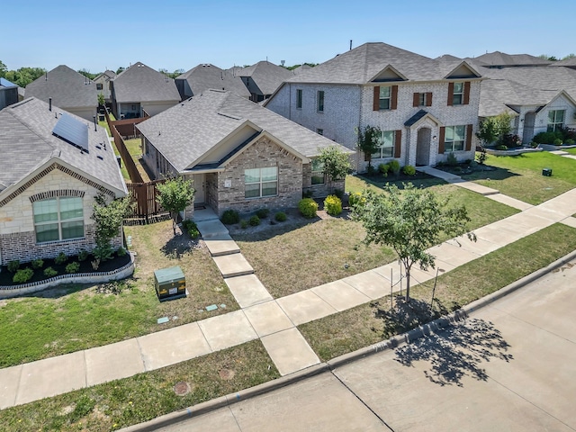 2913 Meadowlands Dr, Forney, TX 75126 - french country inspired facade featuring brick siding, a front lawn, roof with shingles, and a residential view