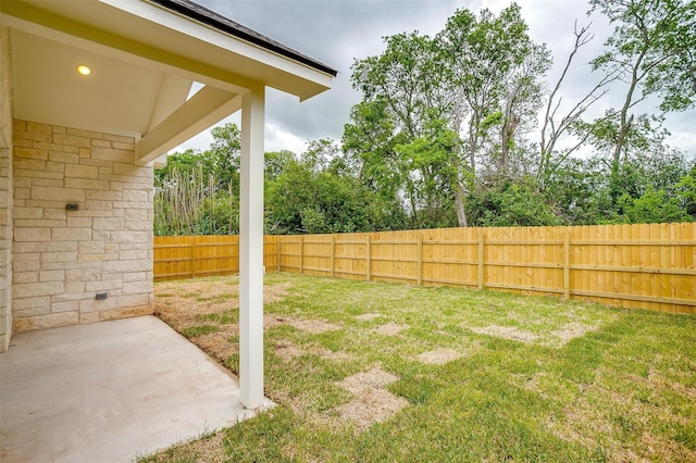 view of yard featuring a patio and a fenced backyard