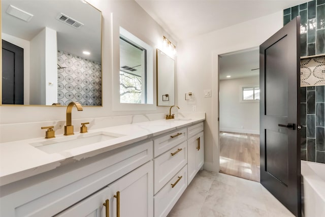 7335 Royal Cir, Dallas, TX 75230 - full bath featuring a sink, baseboards, double vanity, and visible vents