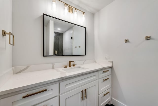 7335 Royal Cir, Dallas, TX 75230 - bathroom with vanity, baseboards, and a shower