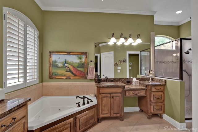 bathroom with crown molding, tile patterned flooring, a stall shower, vanity, and a whirlpool tub