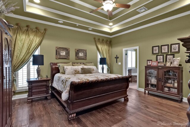 1860 Leonard Rd, Shreveport, LA 71115 - bedroom featuring a tray ceiling, multiple windows, ornamental molding, and dark wood-type flooring
