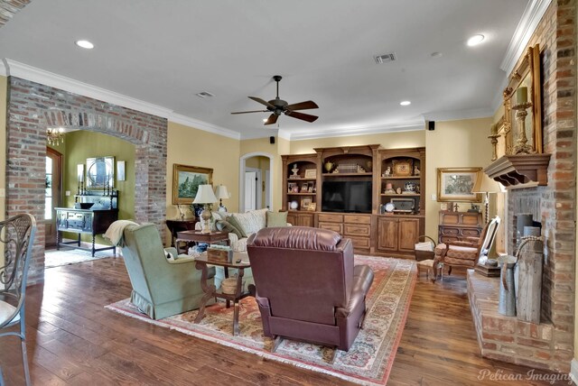 1860 Leonard Rd, Shreveport, LA 71115 - living area featuring arched walkways, a ceiling fan, hardwood / wood-style flooring, ornamental molding, and recessed lighting