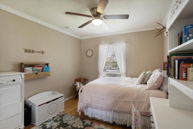 2231 E Peters Colony Rd, Carrollton, TX 75007 - bedroom featuring crown molding, light wood finished floors, ceiling fan, and baseboards