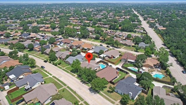 2231 E Peters Colony Rd, Carrollton, TX 75007 - aerial overview of property's location with a pool and nearby suburban area