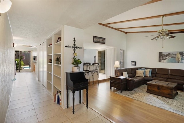 2231 E Peters Colony Rd, Carrollton, TX 75007 - tiled living area featuring lofted ceiling and ceiling fan