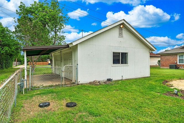 view of home's exterior with a yard, fence, cooling unit, and a gate