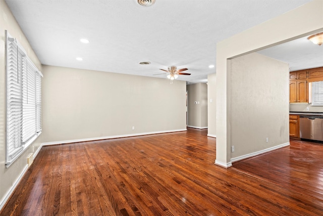 unfurnished living room featuring dark wood-style flooring, a ceiling fan, and recessed lighting