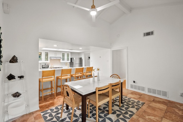 dining space with visible vents, high vaulted ceiling, and beamed ceiling