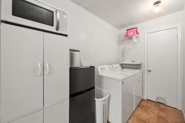 laundry area with washer and dryer and laundry area