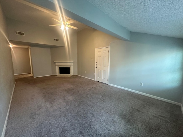 unfurnished living room with ceiling fan, a textured ceiling, visible vents, a fireplace, and carpet flooring