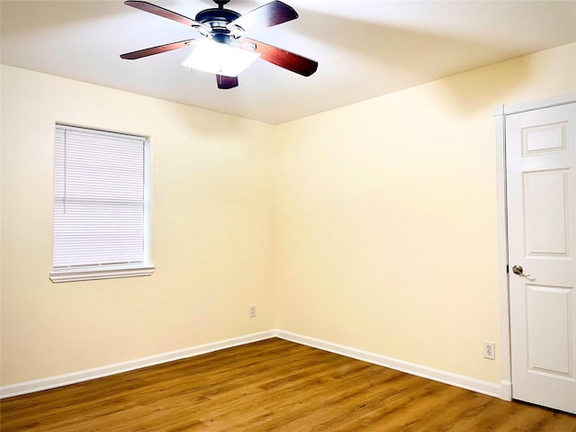 520 Lakeside Dr, Rockwall, TX 75032 - spare room with baseboards, a ceiling fan, and wood finished floors
